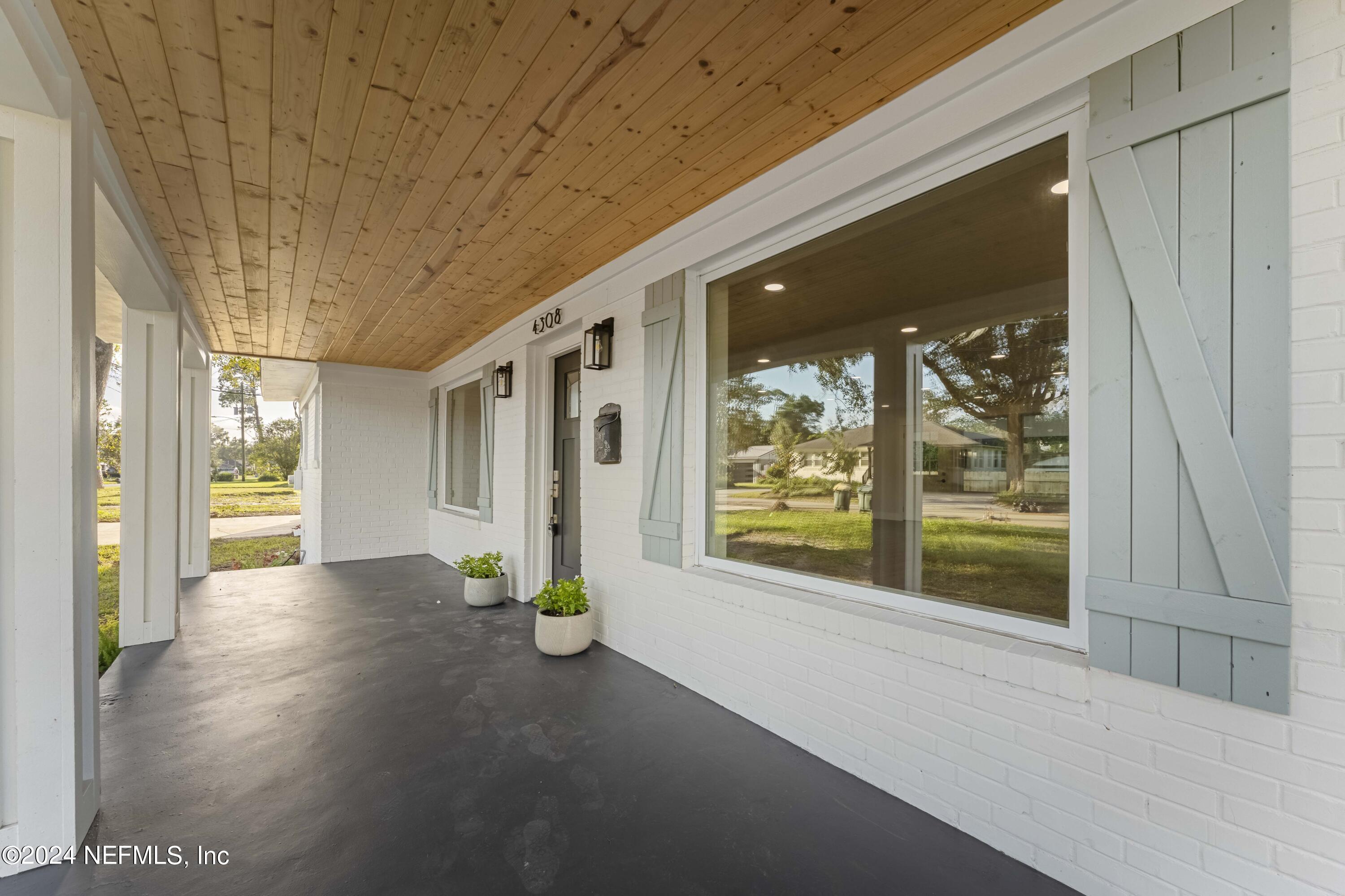 a view of livingroom with furniture and front door