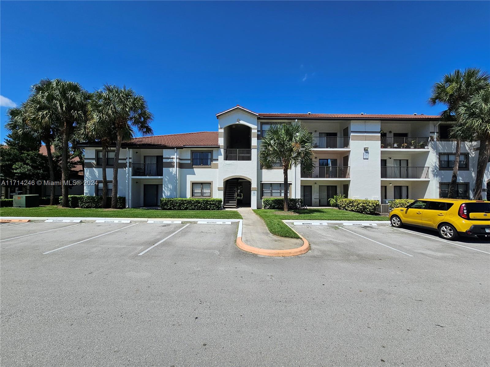 a view of house with outdoor space and parking