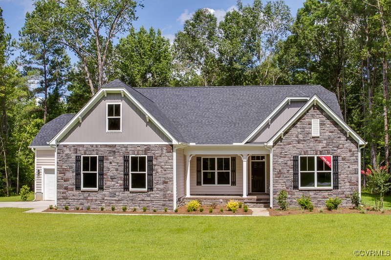 a front view of house with yard outdoor seating and green space