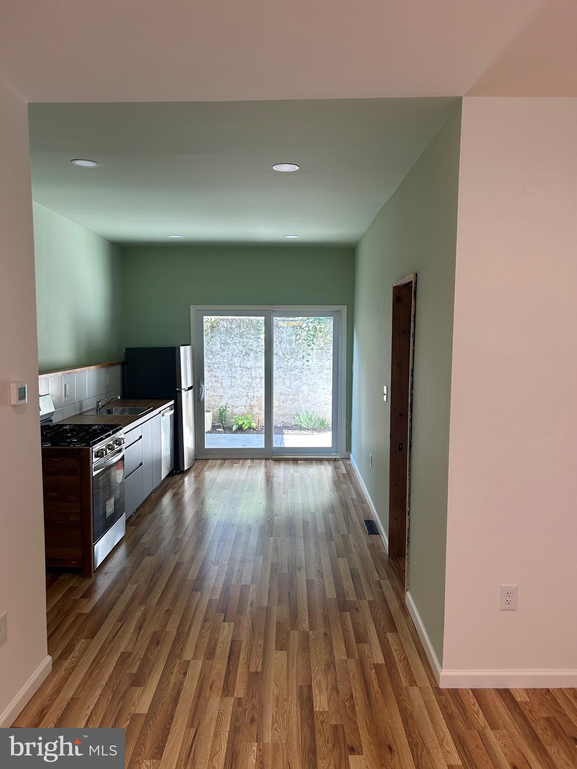 a view of a kitchen from the hallway