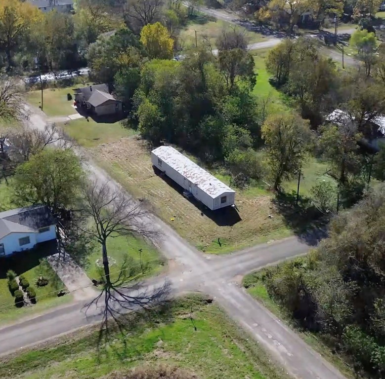 an aerial view of residential house with outdoor space