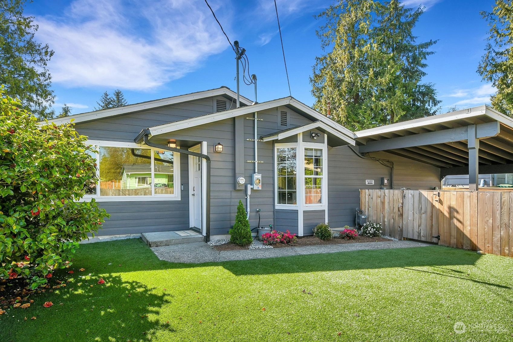 a front view of a house with a yard and porch