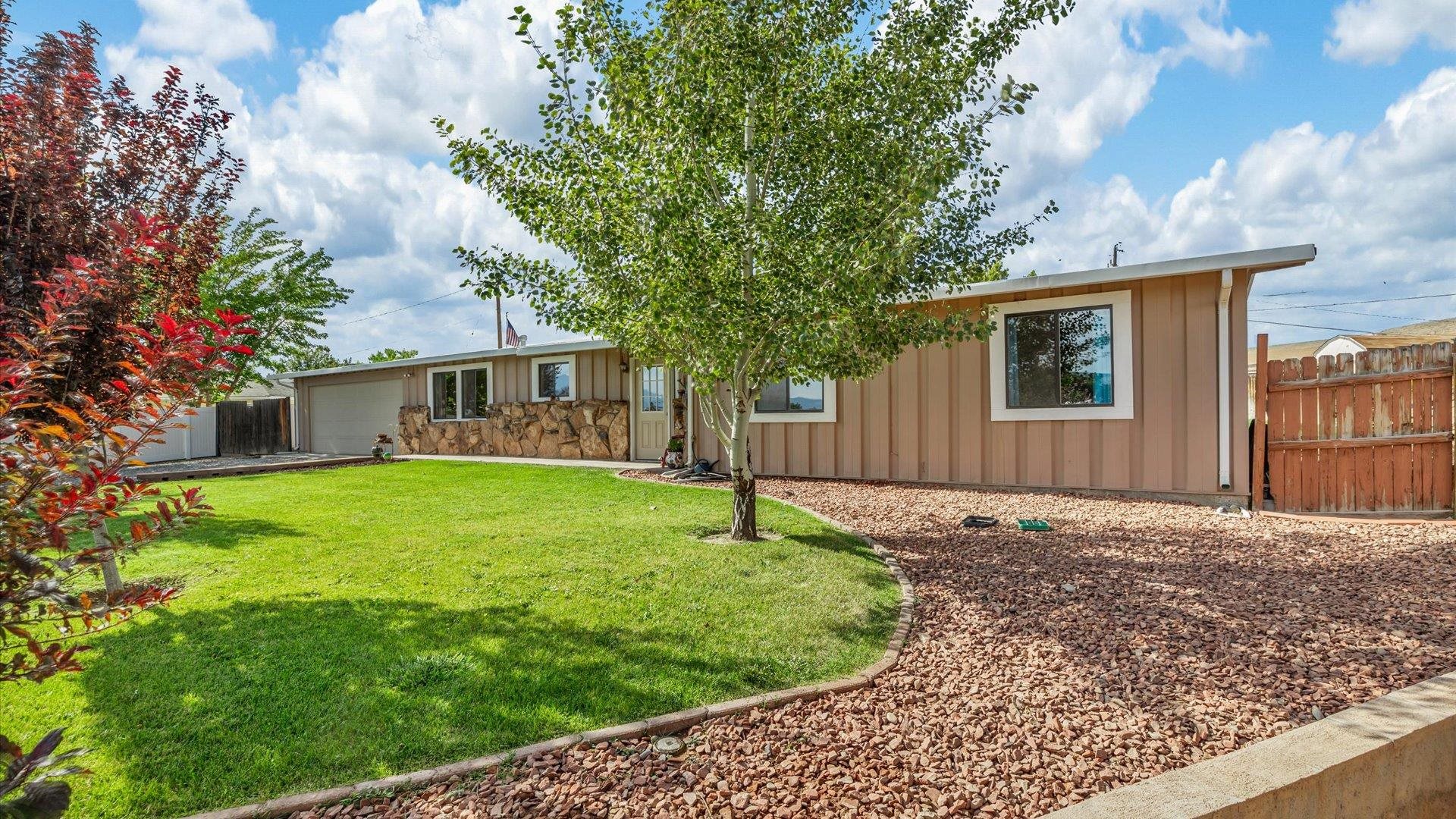 a house with a tree in front of it