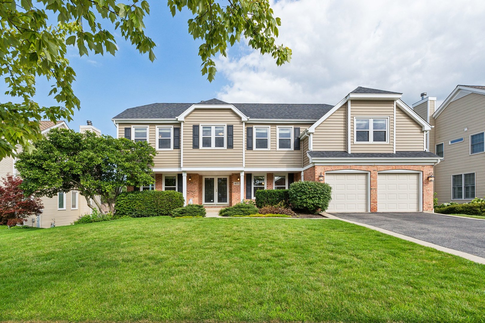 a front view of a house with a yard