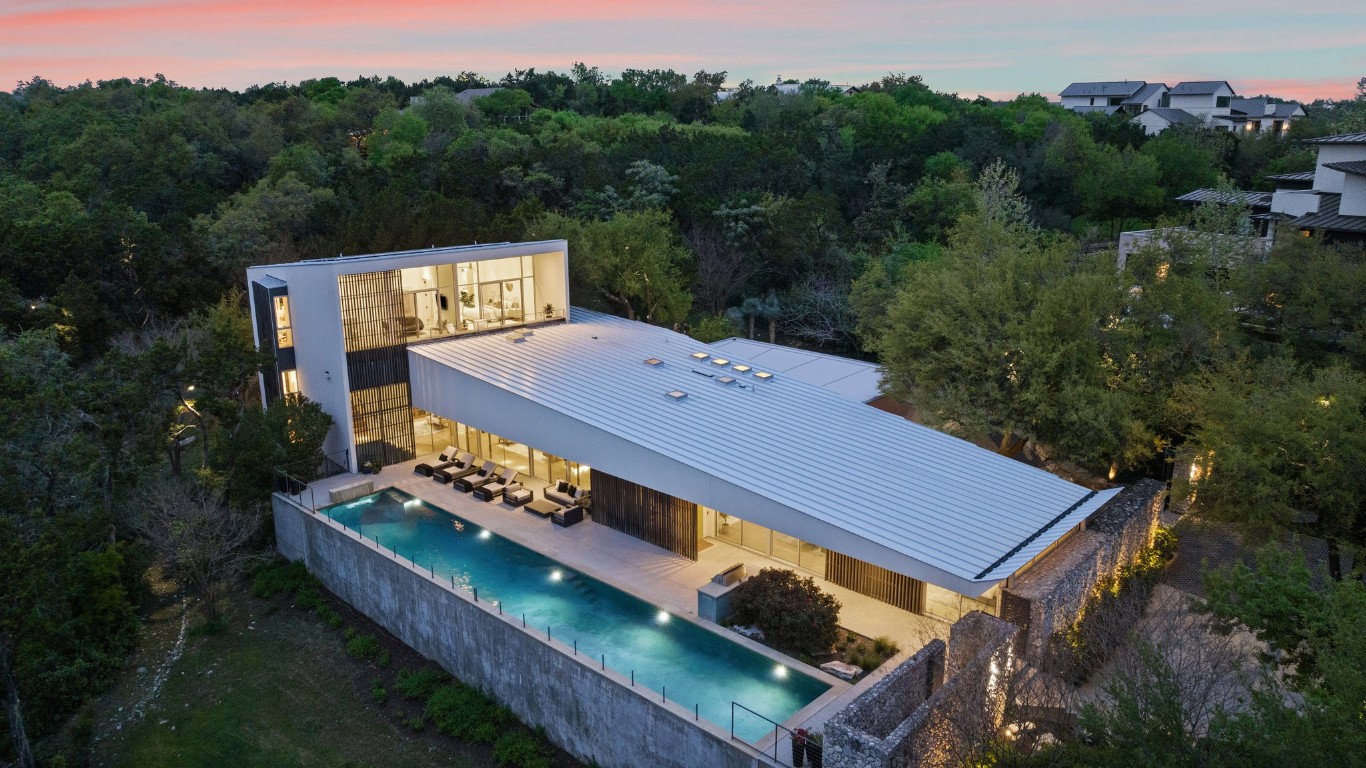 an aerial view of a house having yard table and chairs