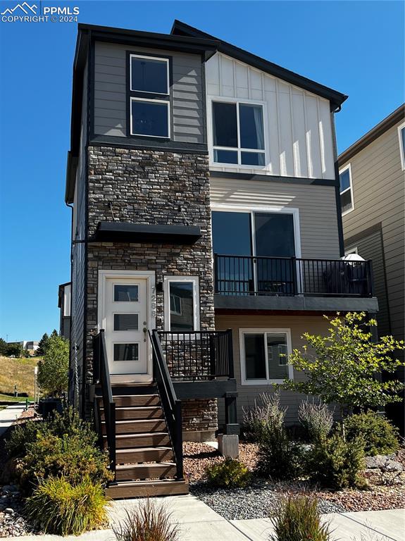 a front view of a house with stairs