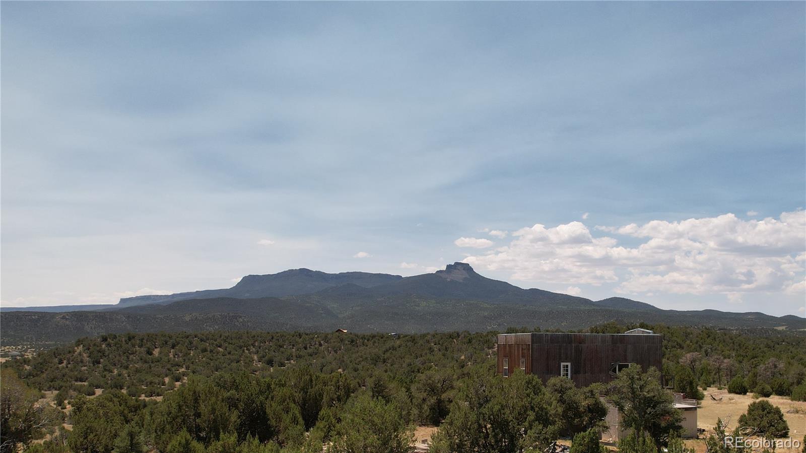 a view of a town with mountains in the background