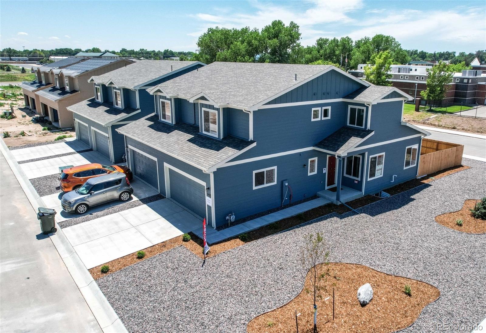 an aerial view of a house with roof deck