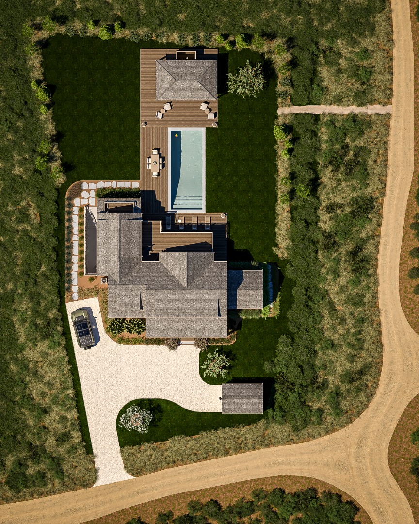 an aerial view of a house with swimming pool large trees and buildings