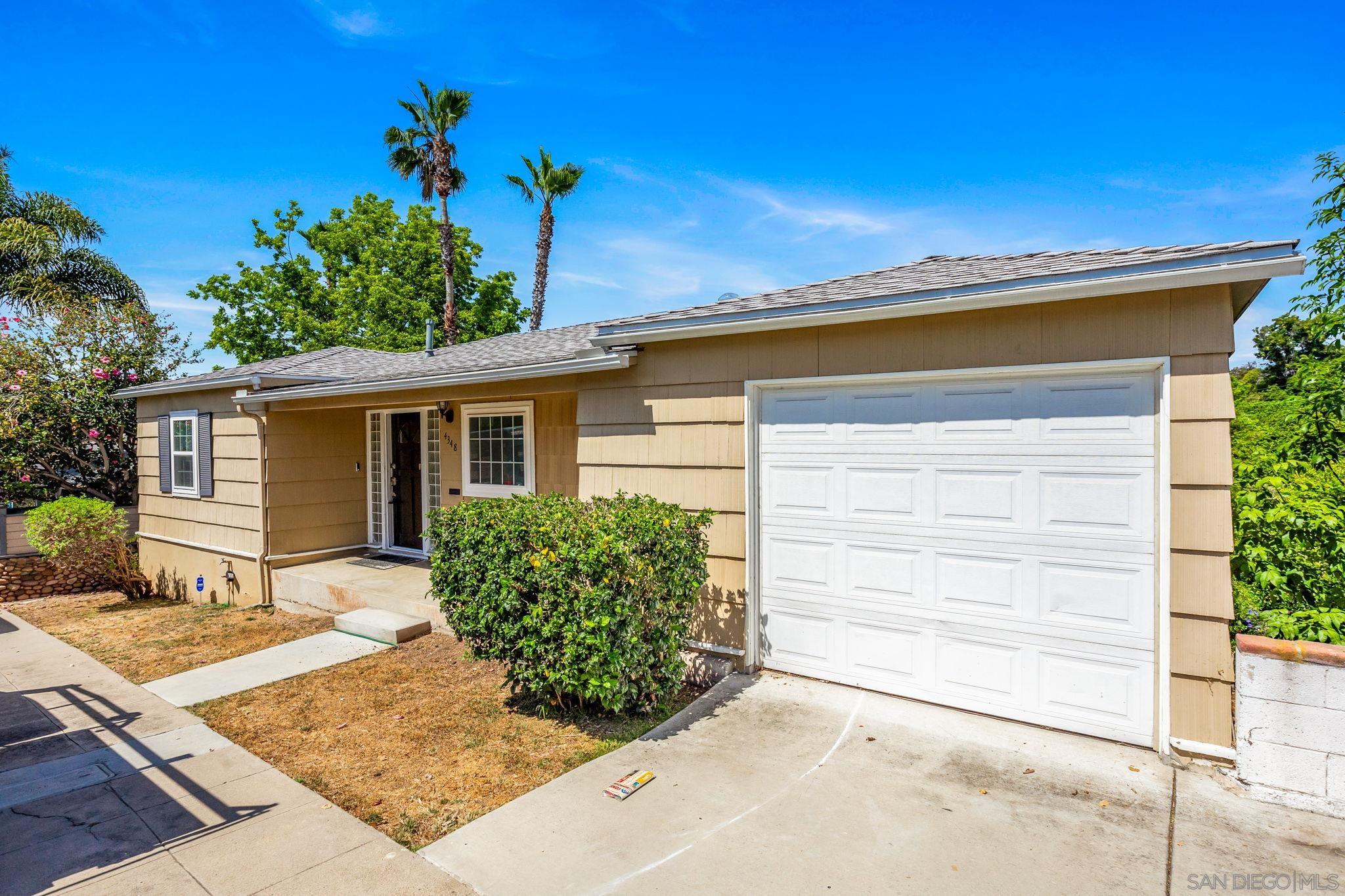 front view of a house with a yard