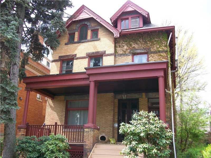 front view of a house with a small yard