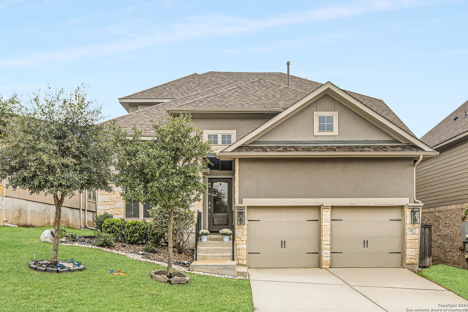 front view of a house with yard