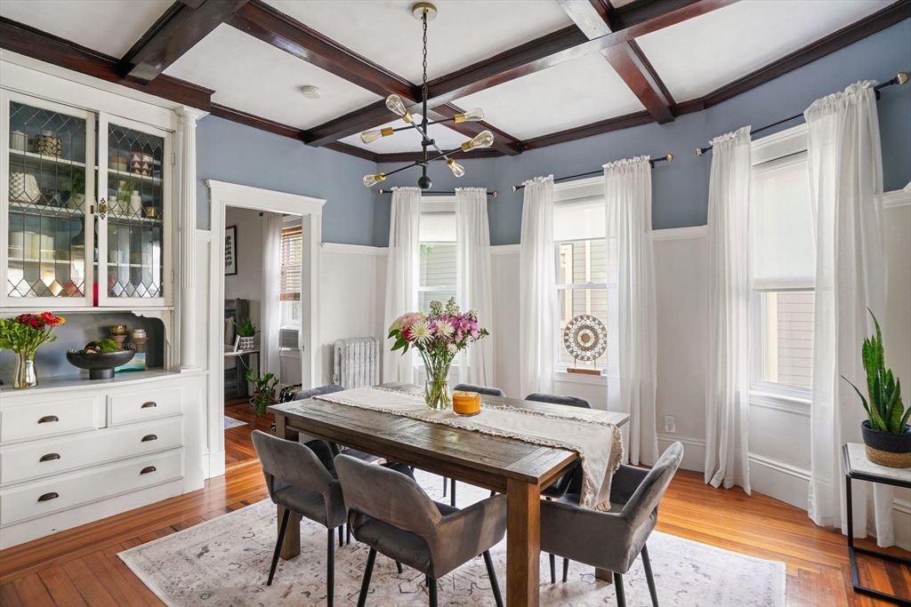 a view of a dining room with furniture and window