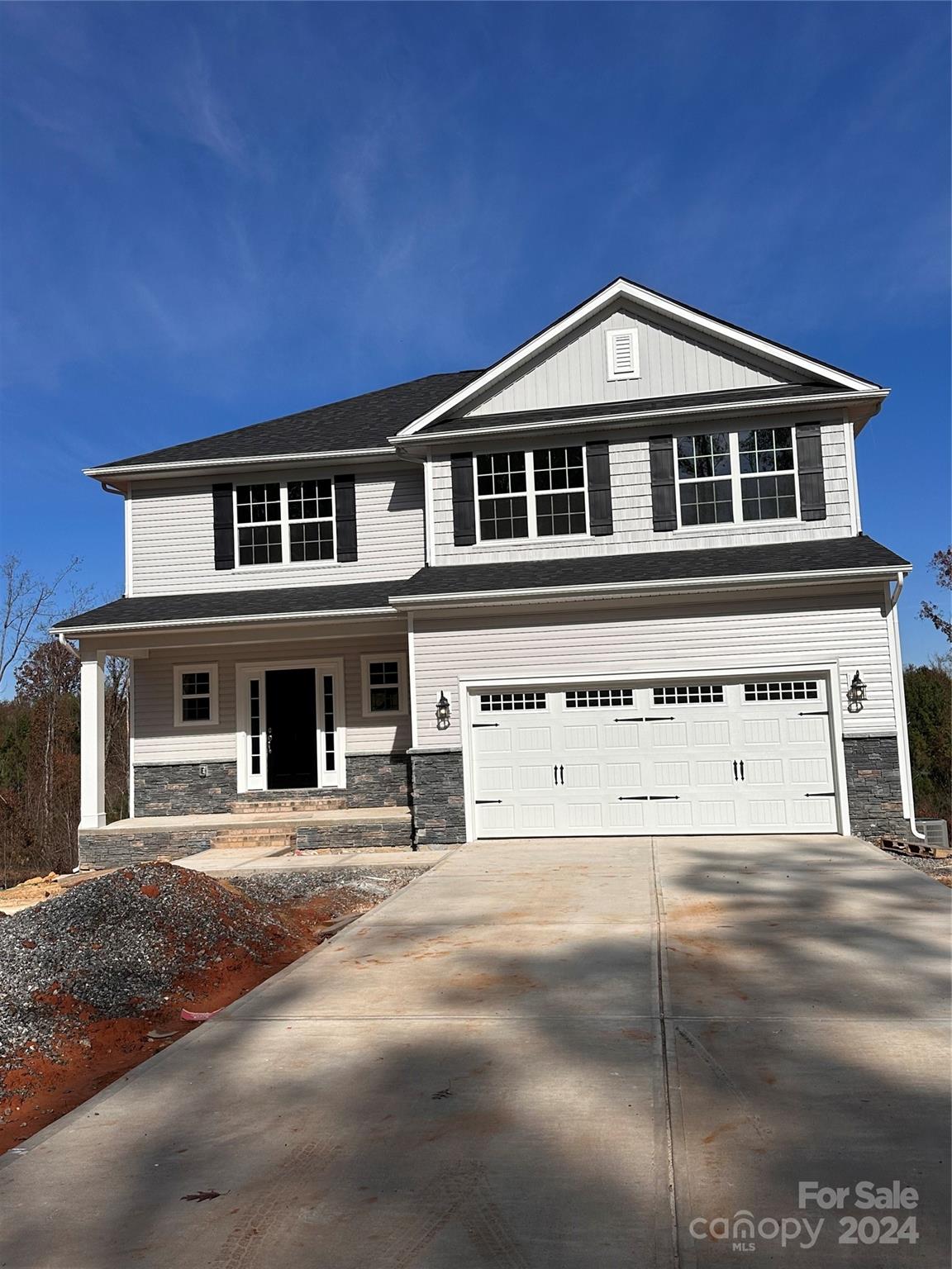 a front view of a house with yard