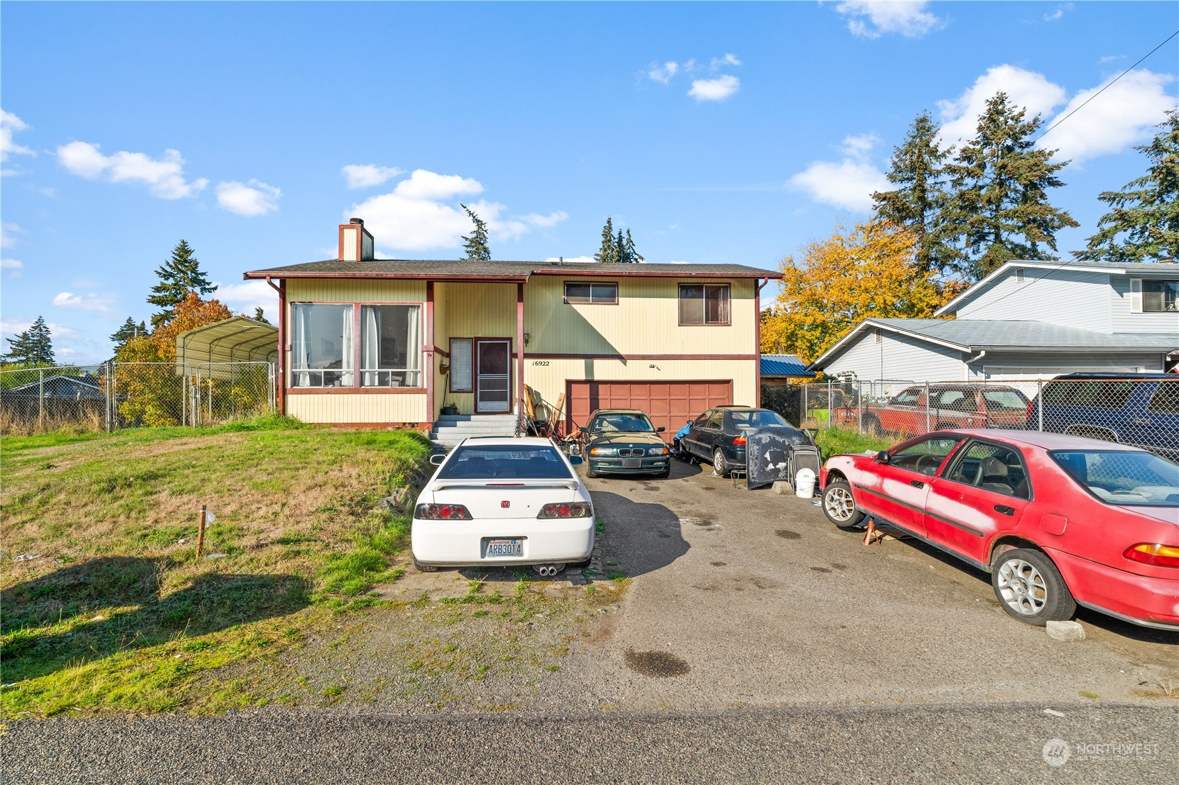 a view of a house with outdoor space and sitting area