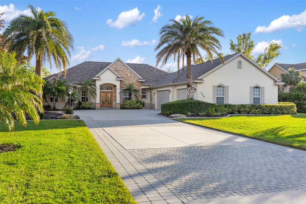 a house with palm tree in front of it