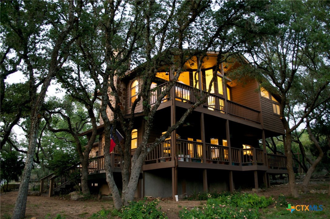 a view of house with a tree