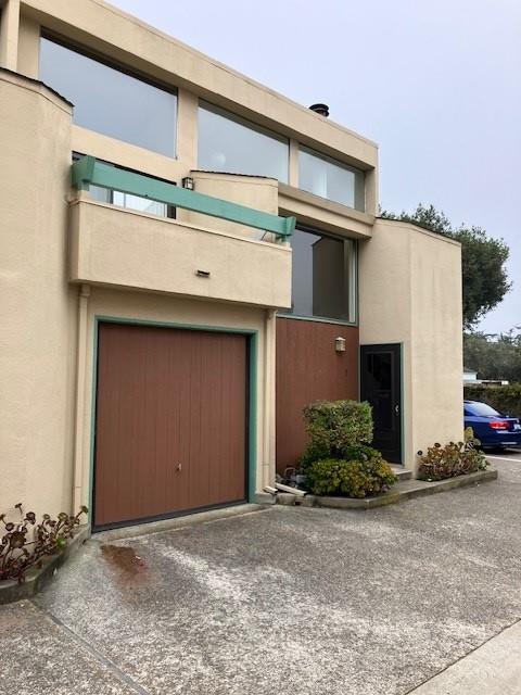 a front view of a house with garage