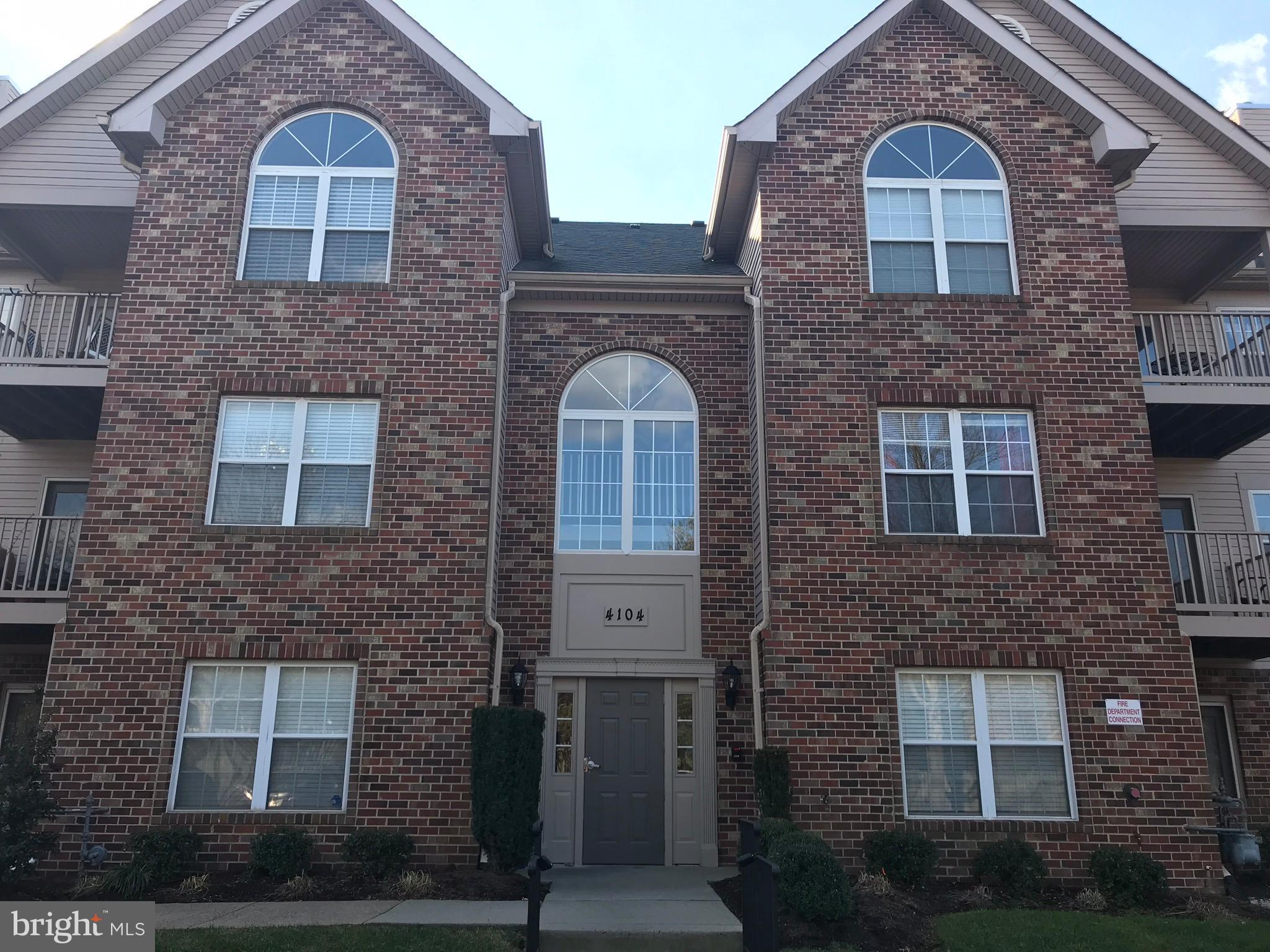 a view of a brick house with a large windows