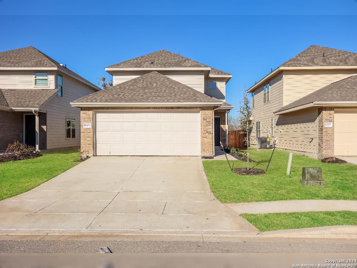 a front view of a house with a yard