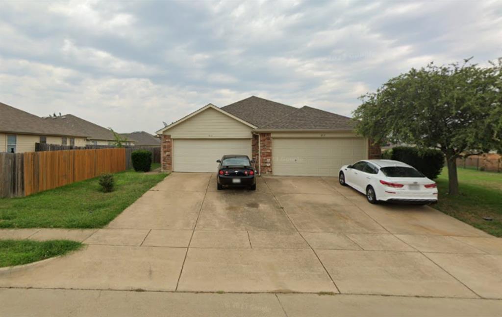 a car parked in front of a house