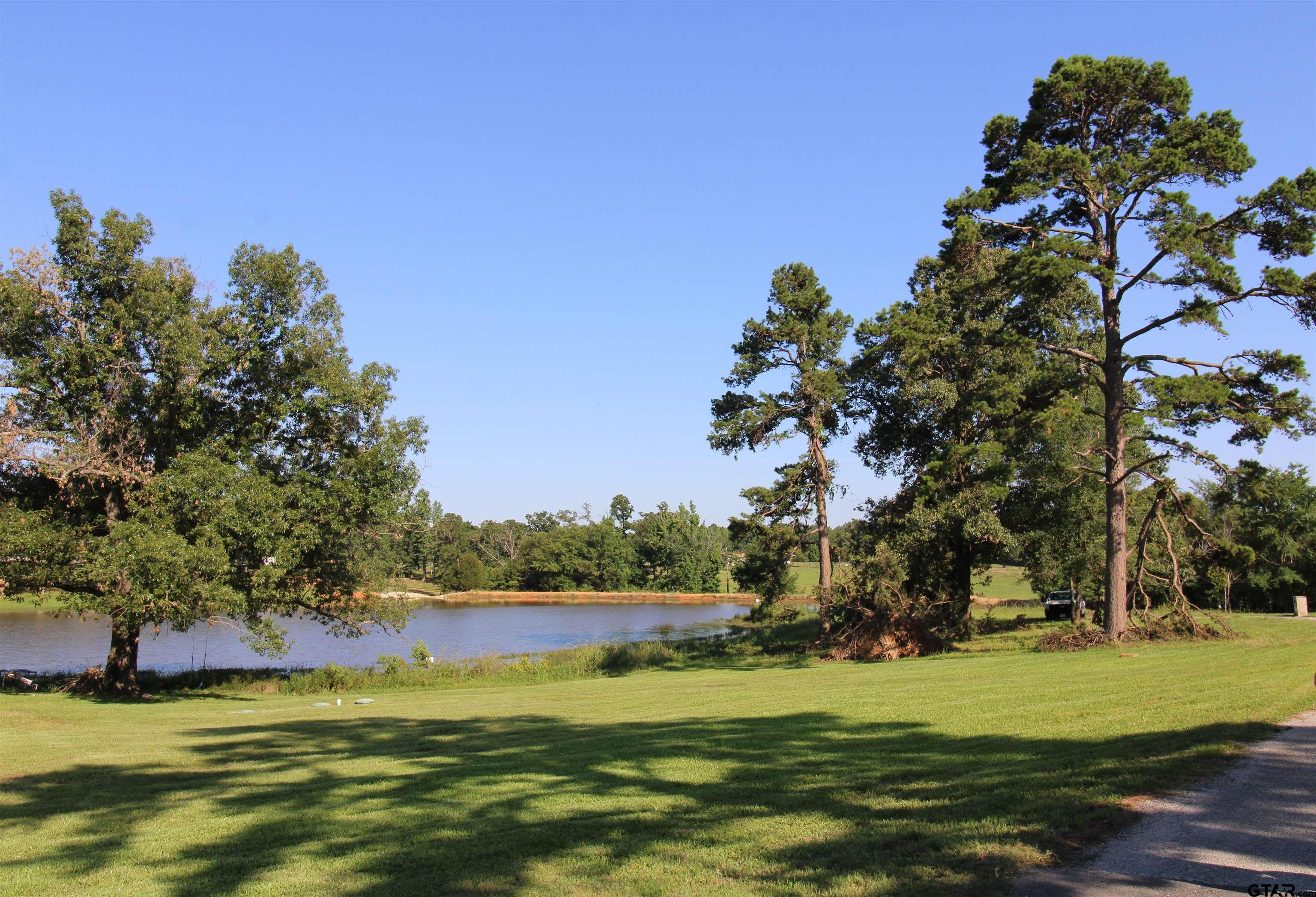 a view of a lake with a big yard