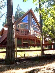 a view of house with a yard