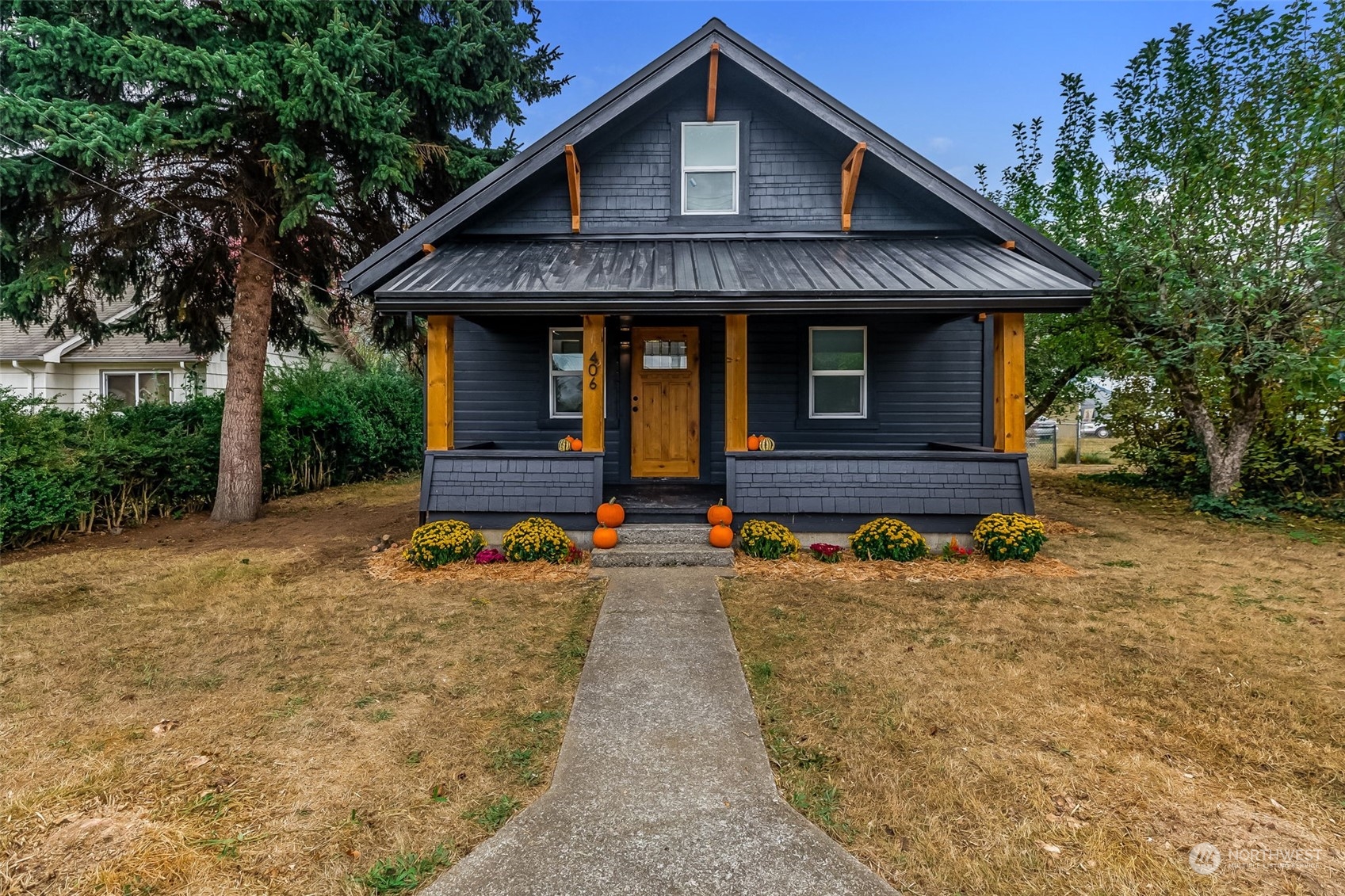 a front view of a house with garden