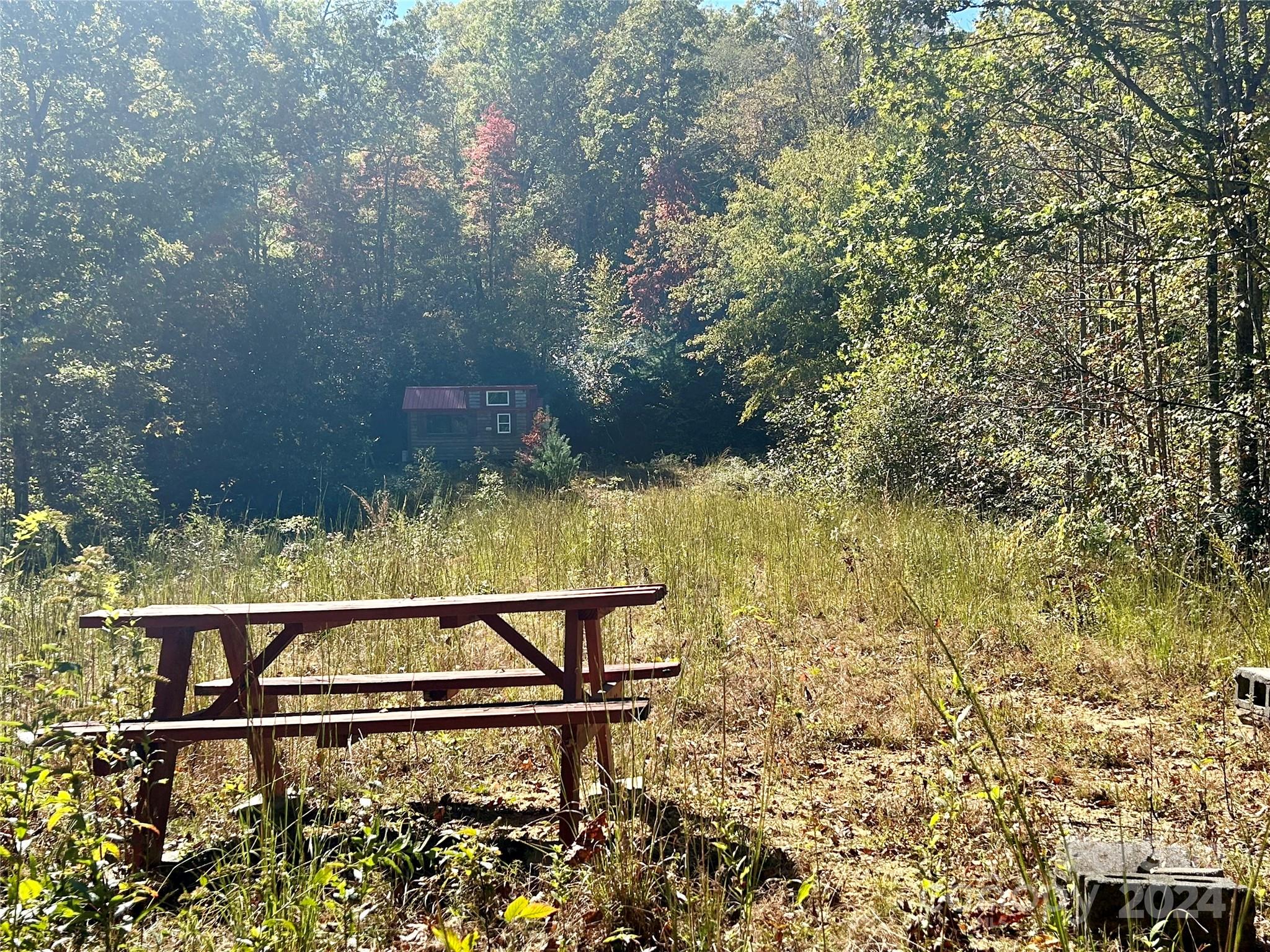 view of backyard with wooden floor and fence