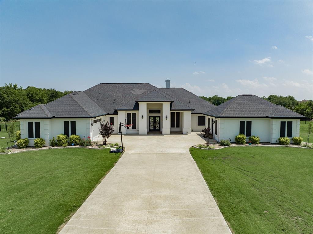 front view of a house with a yard