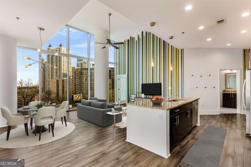 a living room with furniture and a flat screen tv