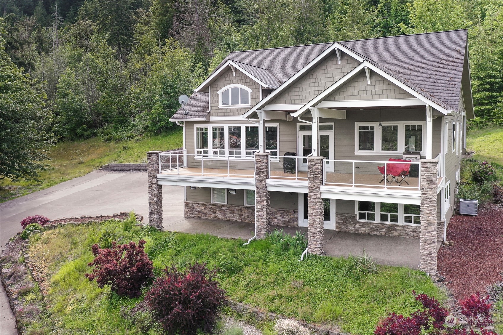 a aerial view of a house with a yard