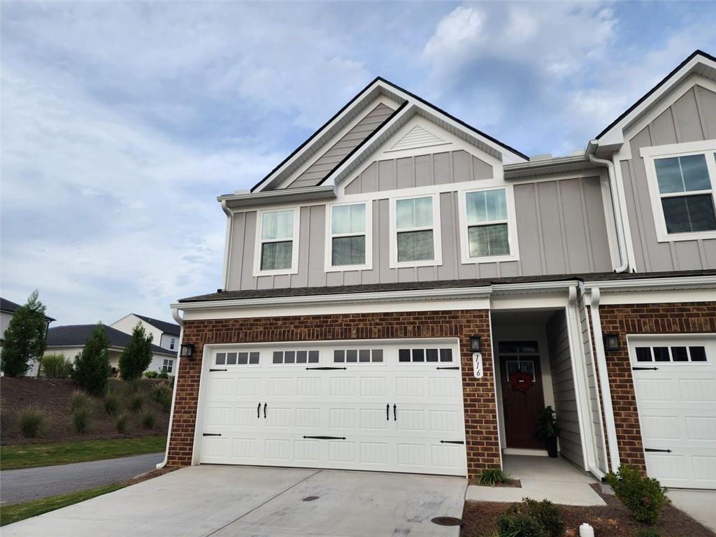 a front view of a house with a garage