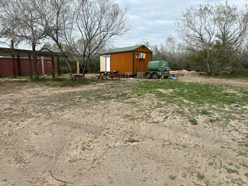 a front view of house with yard and trees