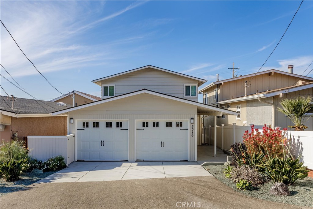 a front view of a house with a garage