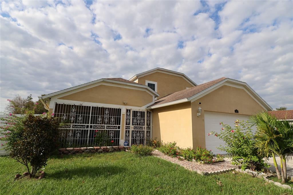 a front view of a house with a yard