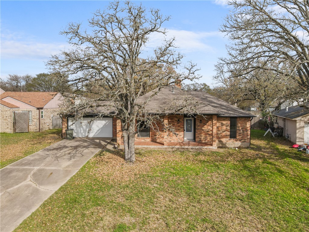 View of front of house with a two car garage and a