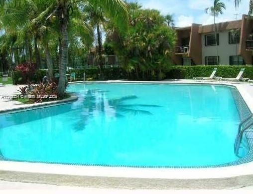 a view of swimming pool with a yard