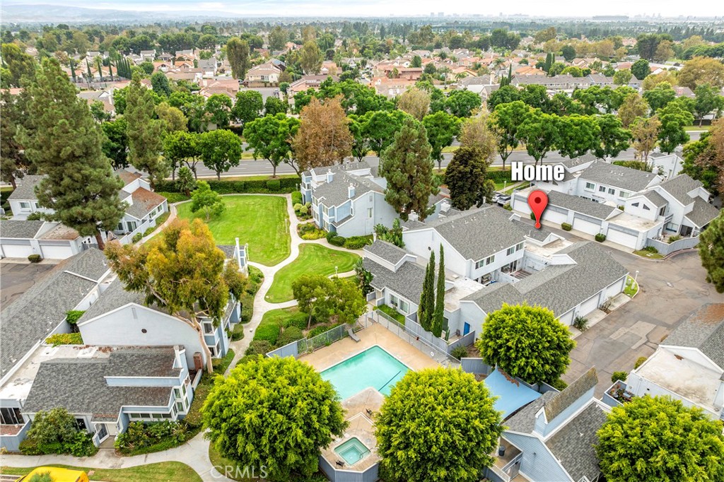 an aerial view of residential houses with outdoor space