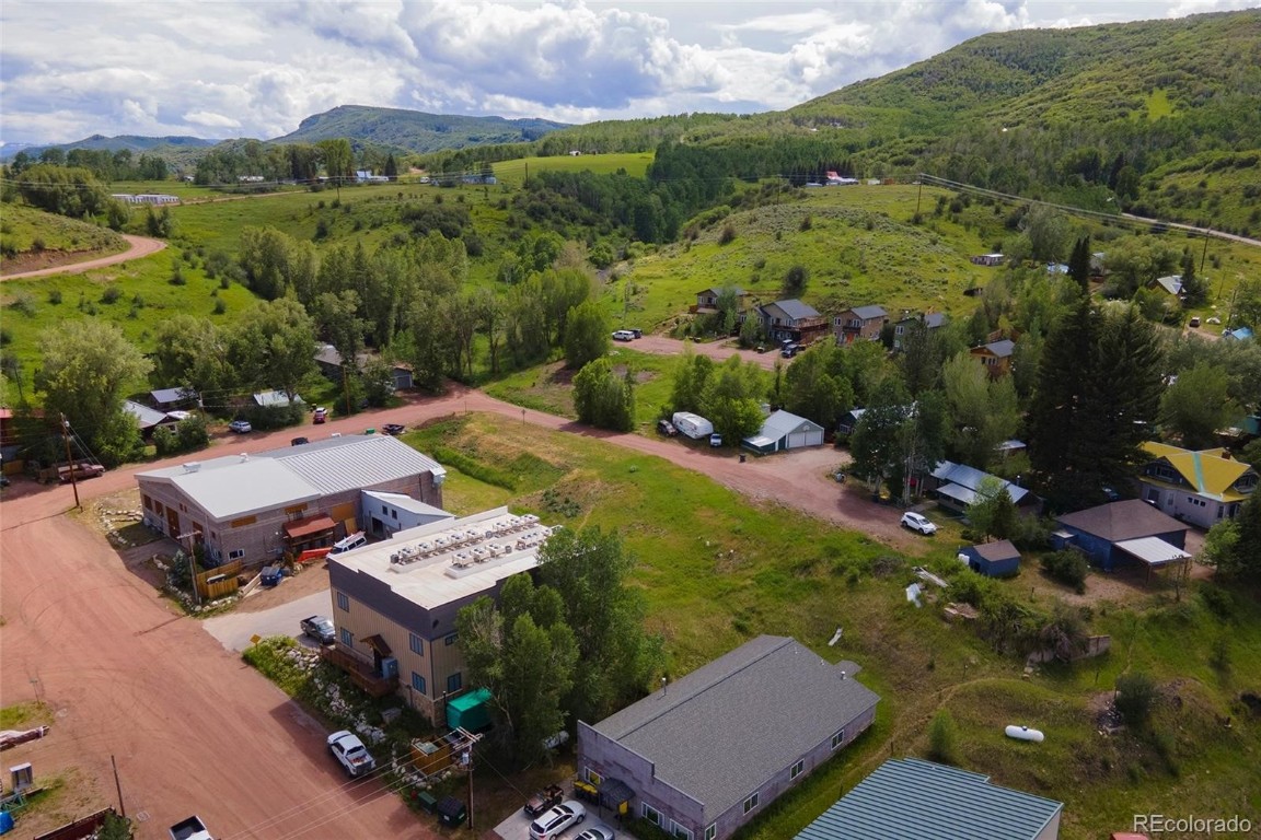 an aerial view of a house with a garden