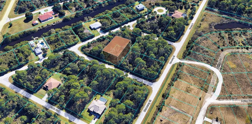 an aerial view of a house with a yard basket ball court