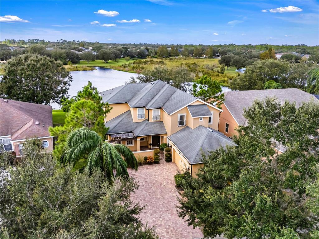 an aerial view of a house with a lake view