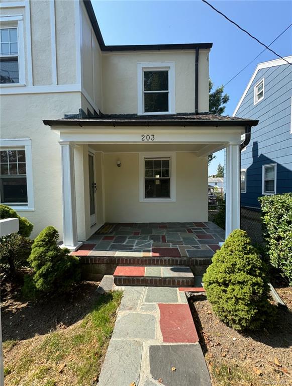 Entrance to property with covered porch