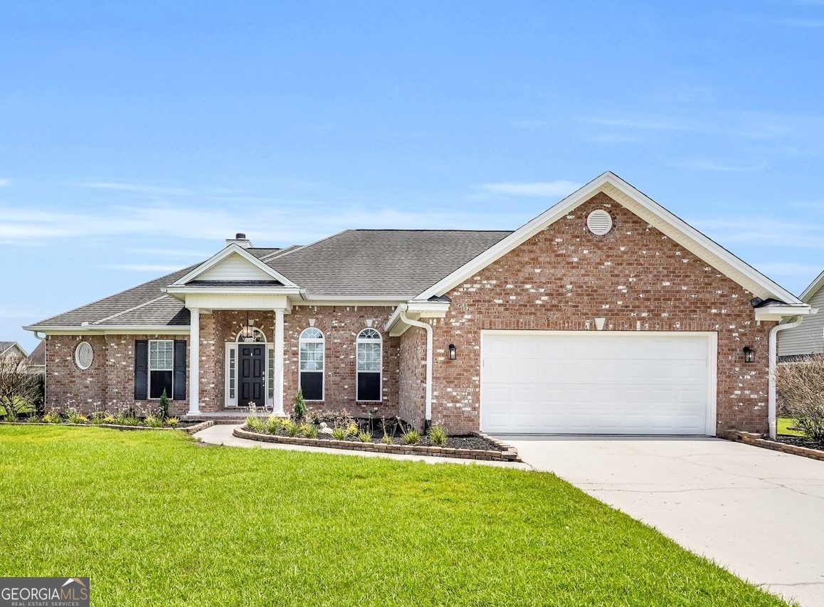 a front view of a house with yard porch and outdoor seating