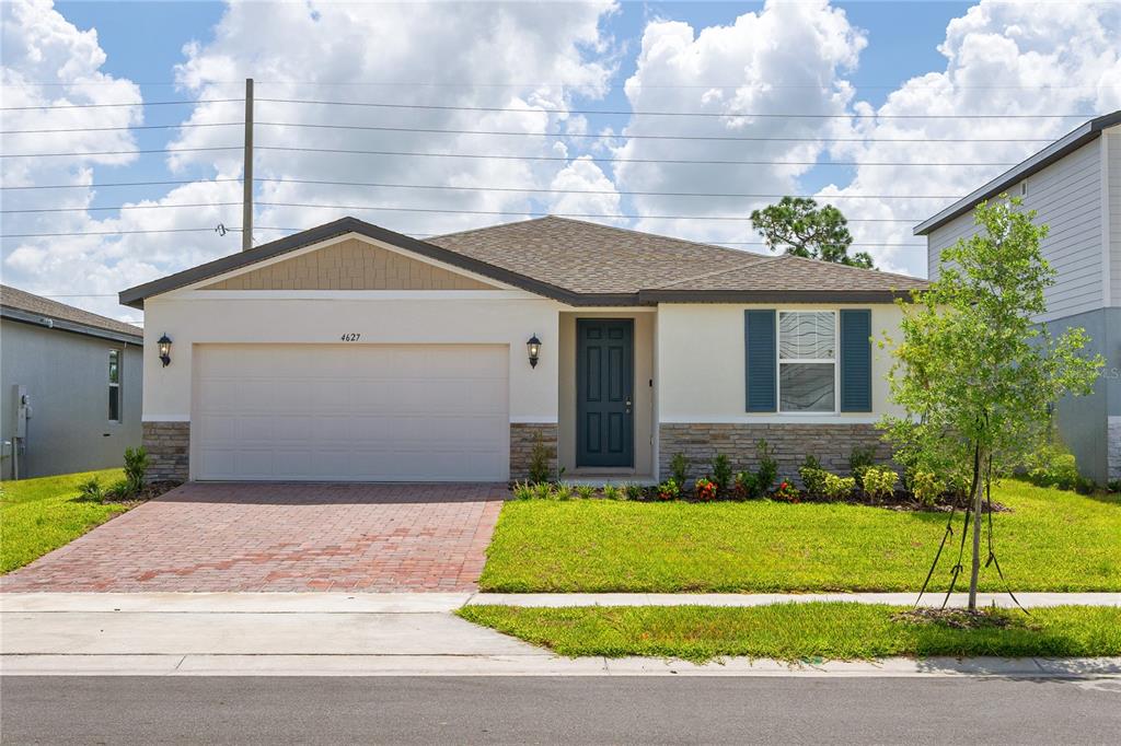 a front view of a house with a yard