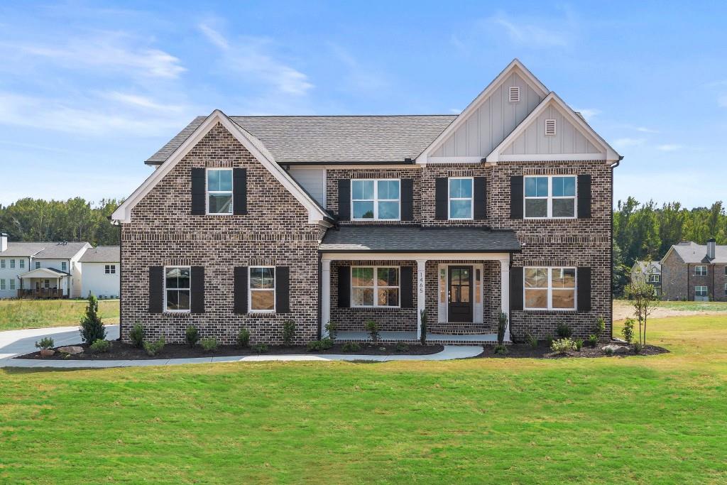 a front view of a house with a yard