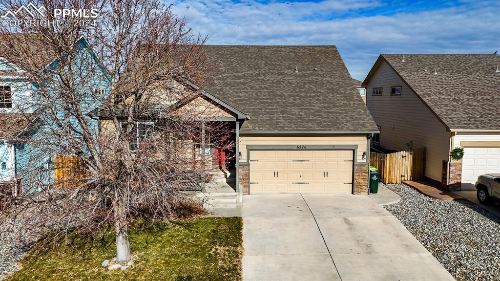 front view of a house with a yard