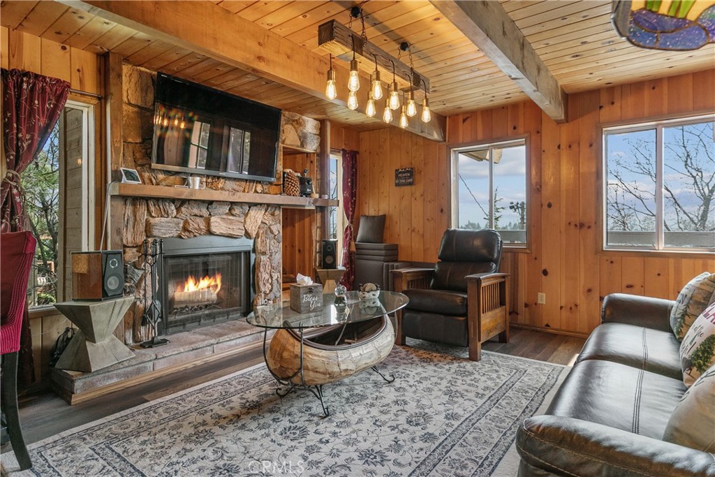 a living room with furniture a window and a fireplace