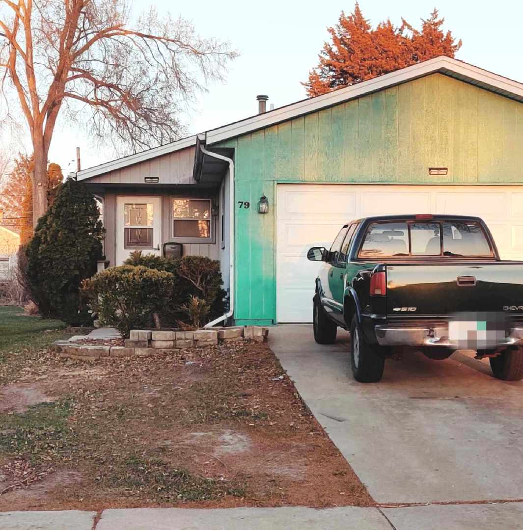 a car parked in front of a house