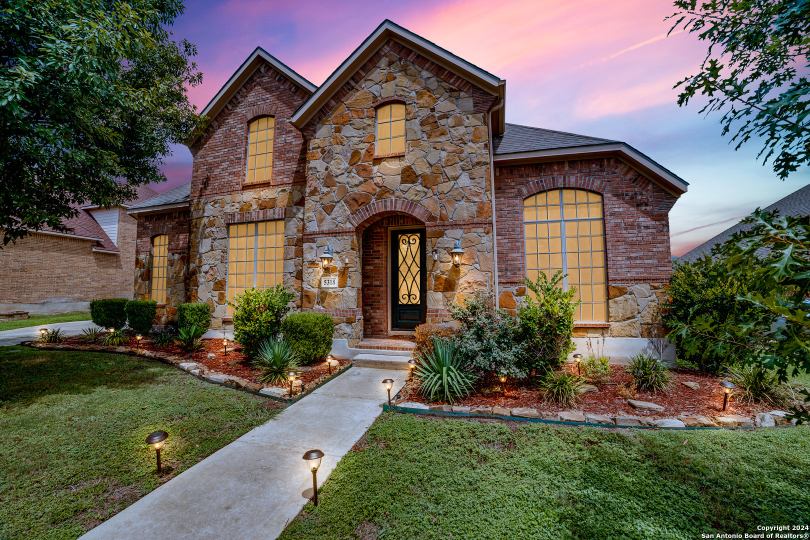 a front view of a house with a yard